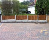 Stepped gravel boards with top of fencing level.